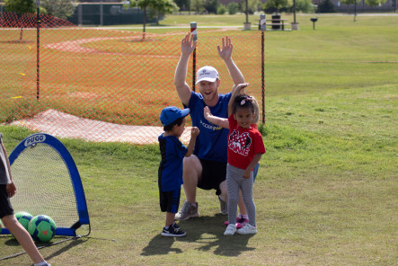 Kids playing baseball at Frontier Park in Prosper, Texas